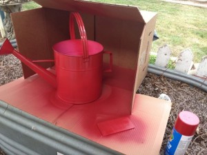 My grandma is always full of good ideas! She set me up with a cardboard box and put a long piece in between the flap. This worked amazing! You just spray into the box and it didn't make a mess!