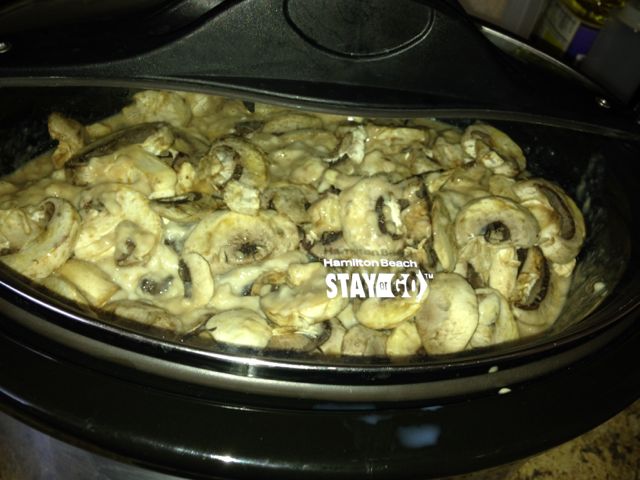 Throw the cream of mushroom soup, gravy, and a good splash of milk in and stir.  Throw the tenderized round steak in the tub and throw the fresh mushrooms up top!