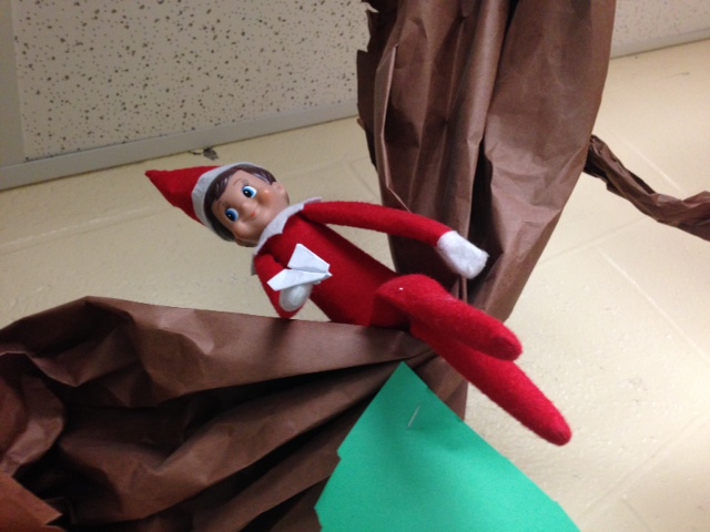 Day 9:  Elfie makes a paper airplane!