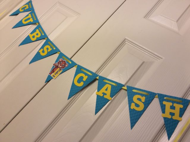 Cubs Cash is an incentive for good behavior in the building, I even made a Cub look like he was holding some Cubs Cash! I embossed these pennants with polka dots since she has polka dots in her classroom as well. I thought this one turned out so cute!