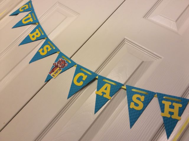 Cubs Cash is an incentive for good behavior in the building, I even made a Cub look like he was holding some Cubs Cash!  I embossed these pennants with polka dots since she has polka dots in her classroom as well.  I thought this one turned out so cute!