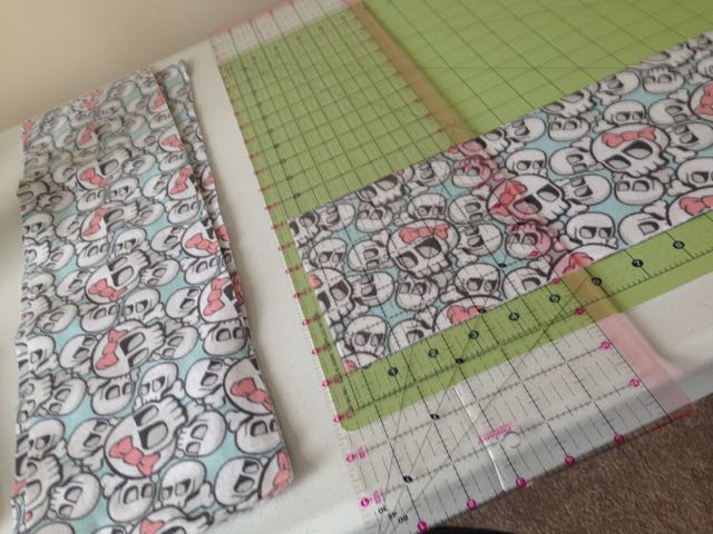 First, you need to cut your flannel into 6x6" squares.  I ended up folding the fabric in half and pressing it to get all the wrinkles out.  Then I cut 6" strips that I cut into 6x6" squares.  It makes it much easier when you have a rotary cutter and mat!