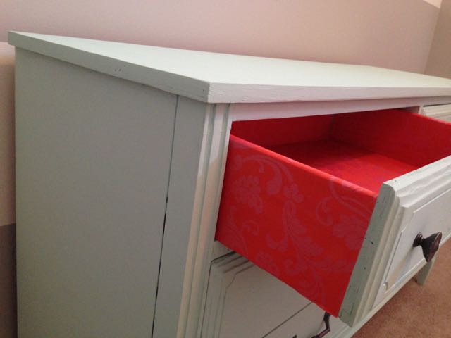 I love the pop of color when you open the dresser drawer!   Click here for the tutorial on how to line your dresser drawers!