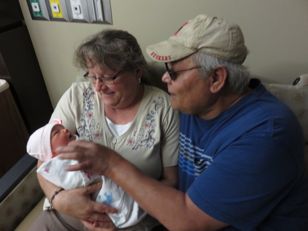 Grandma and Grandpa Tafoya get their hands on our sweet girl!