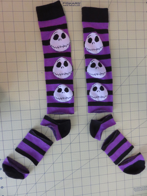 Cut the socks right above the heel, under the heel, and before the toe. Then toss the heel and toe pieces